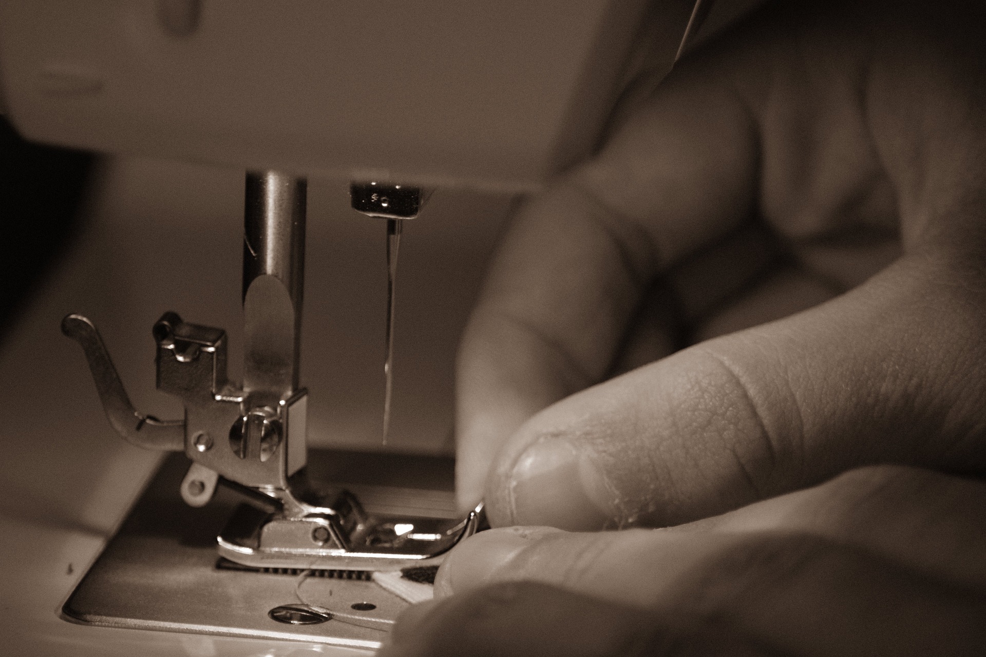 Tailor working at sewing machine